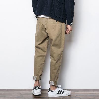 Chino pants for men with inside text printed on bottom cuff