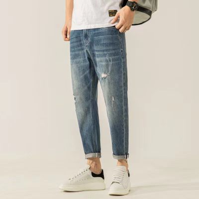Ripped stretch carrot fit jeans in vintage mid wash blue for men