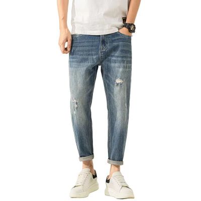 Ripped stretch carrot fit jeans in vintage mid wash blue for men