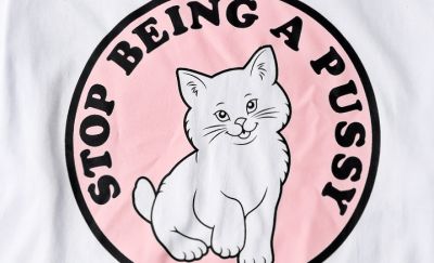 Stop being a Pussy Unisex Cotton T shirt