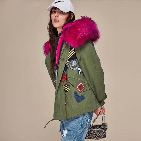 Women's winter coat with embroidered badges and fur hood